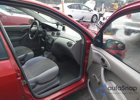 2004 Ford Focus Lx z USA, uszkodzony, nr VIN 1FAFP33PX4W121241